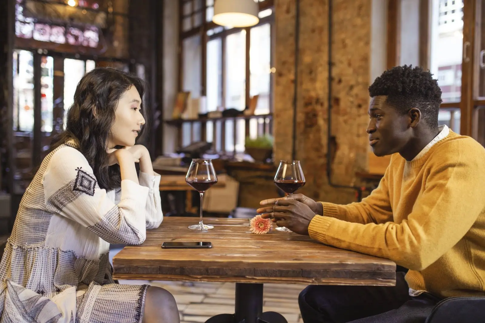 Two people meeting for a first date in a café