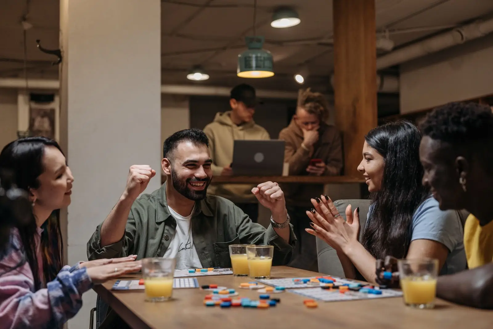 Friends laughing over a board game